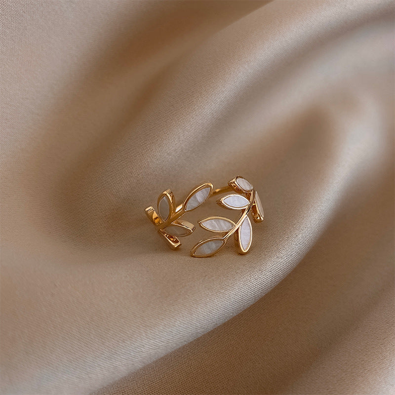 Hattie™ - ADJUSTABLE RING WITH LEAF DESIGN AND WHITE OPAL ACCENT
