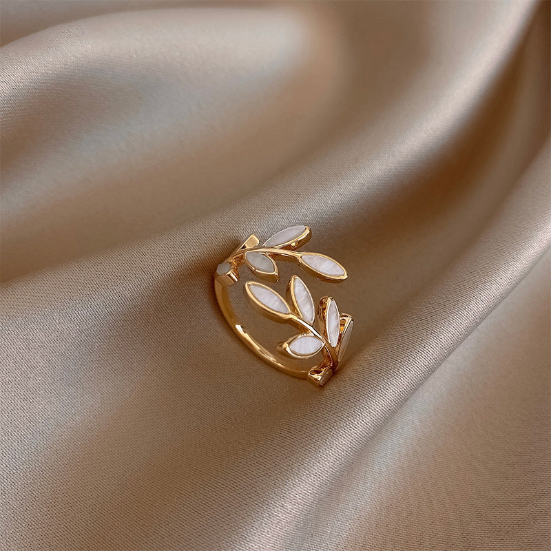 Hattie™ - ADJUSTABLE RING WITH LEAF DESIGN AND WHITE OPAL ACCENT